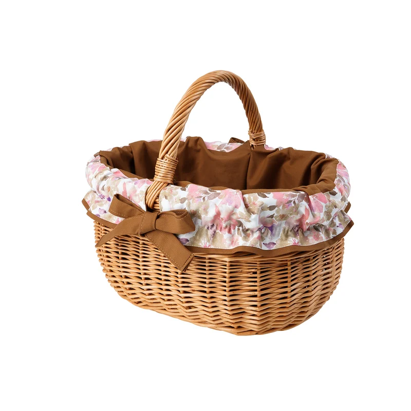 Werburga wicker shopping basket with brown trim and a handle by TheWickerStories