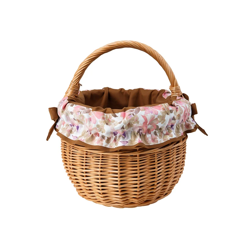 Werburga wicker shopping basket with brown trim and a handle by TheWickerStories