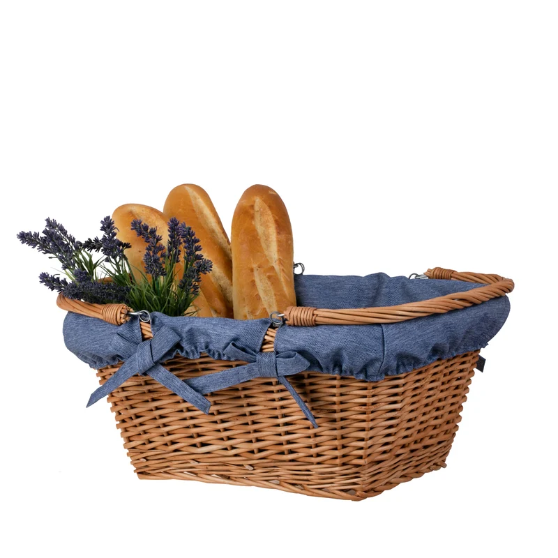 Wulfhildis shopping basket with a wicker handle and blue trim TheWickerStories