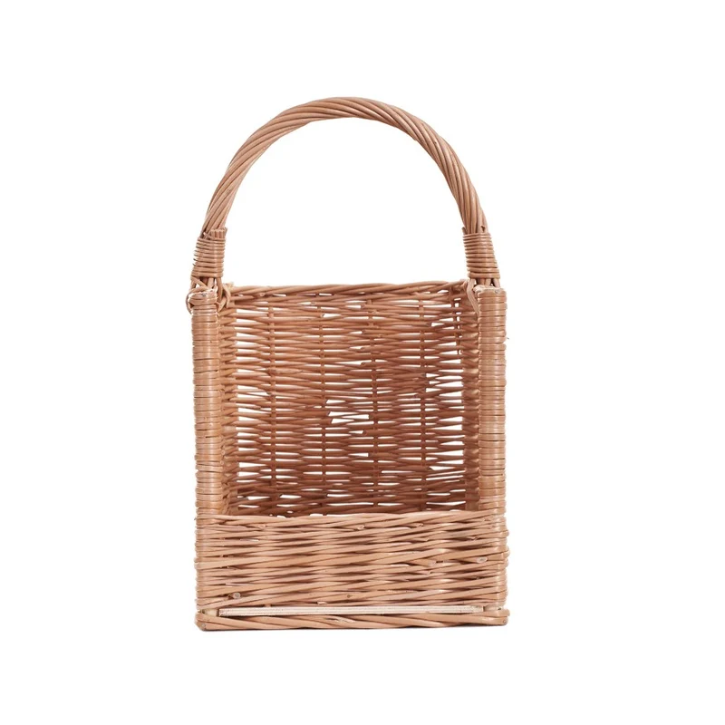 Feloria wicker firewood basket with handle and lowered front TheWickerStories