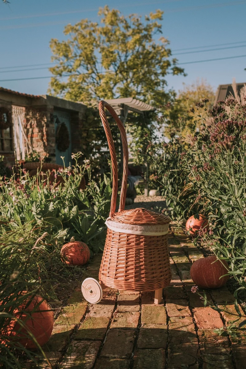 Betula wicker storage basket with cream lining, handle and wheels TheWickerStories