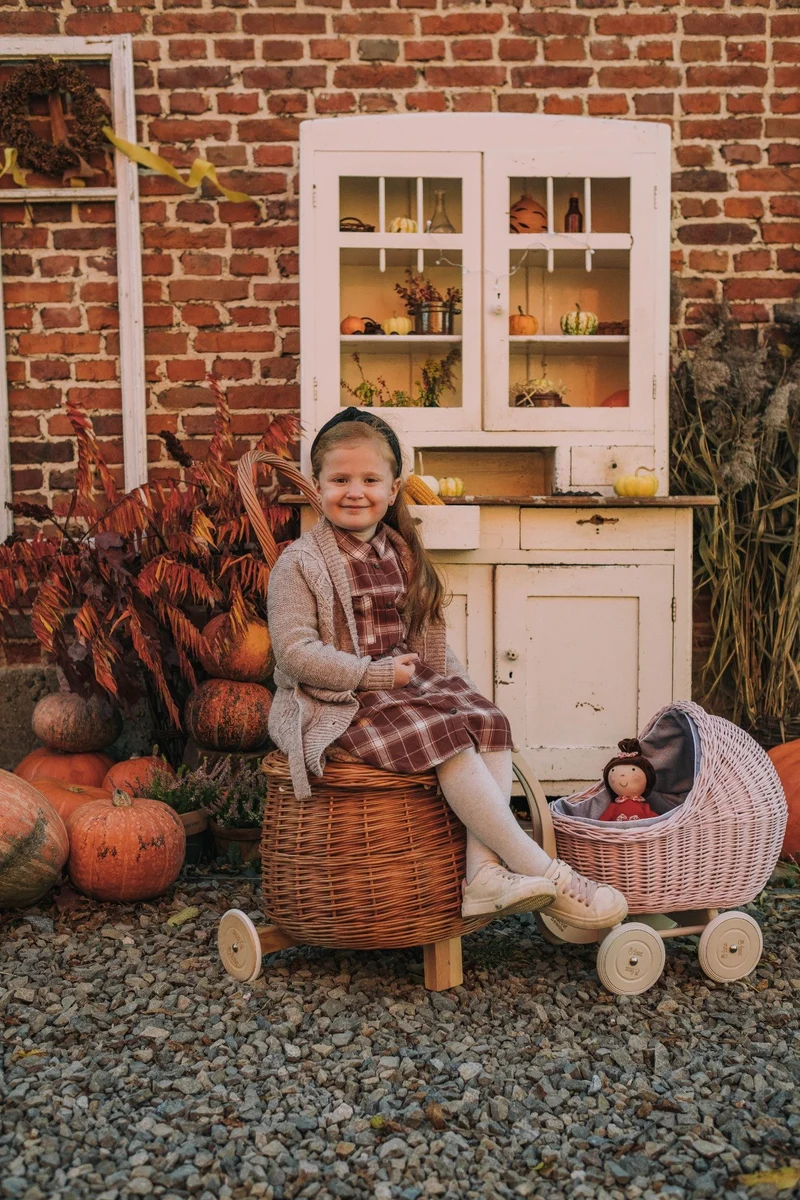 Salix wicker storage pouf with beige trim, cushion and caster wheels TheWickerStories