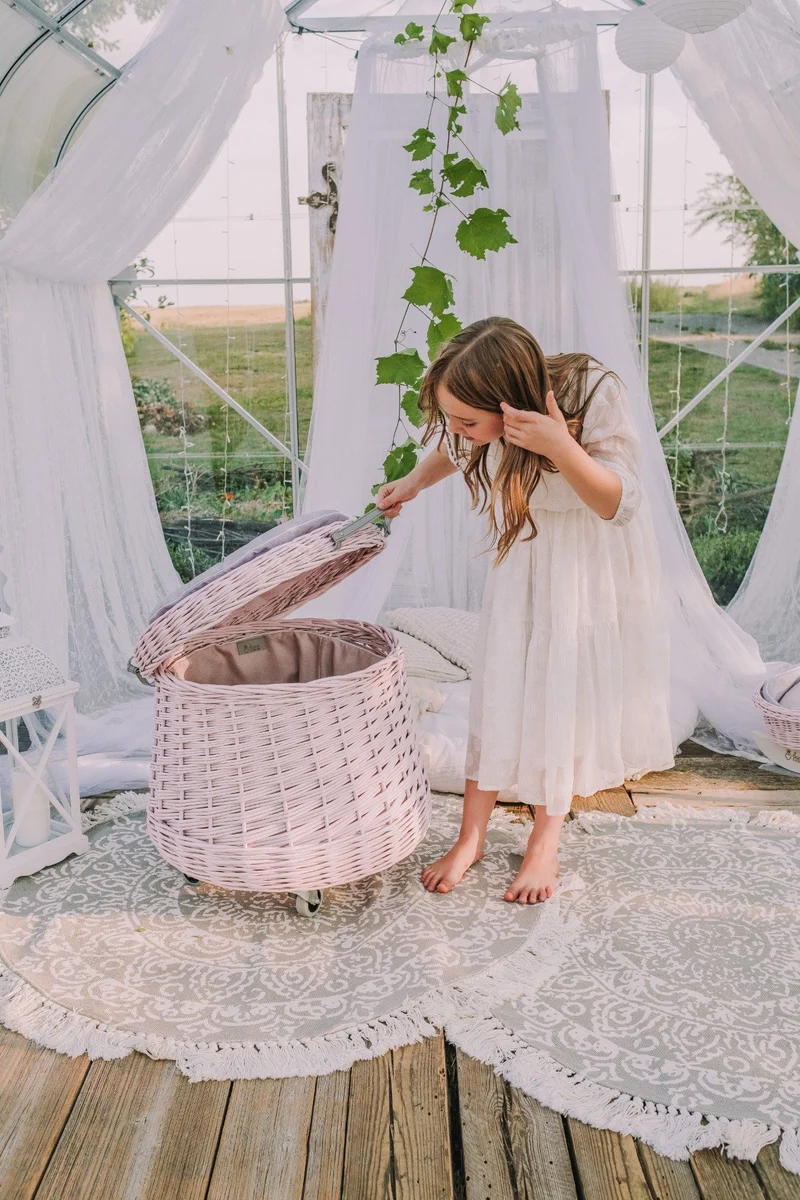 Vinca wicker toy chest for the kids' room with pink trim and wheels TheWickerStories