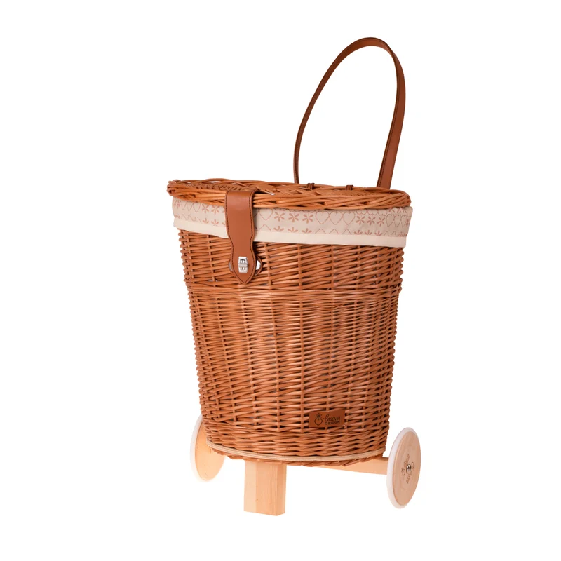 Celtis wicker basket on wheels with cream trim and straps TheWickerStories