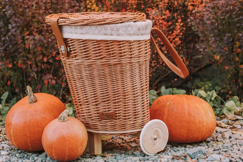 Celtis wicker basket on wheels with cream trim and straps TheWickerStories