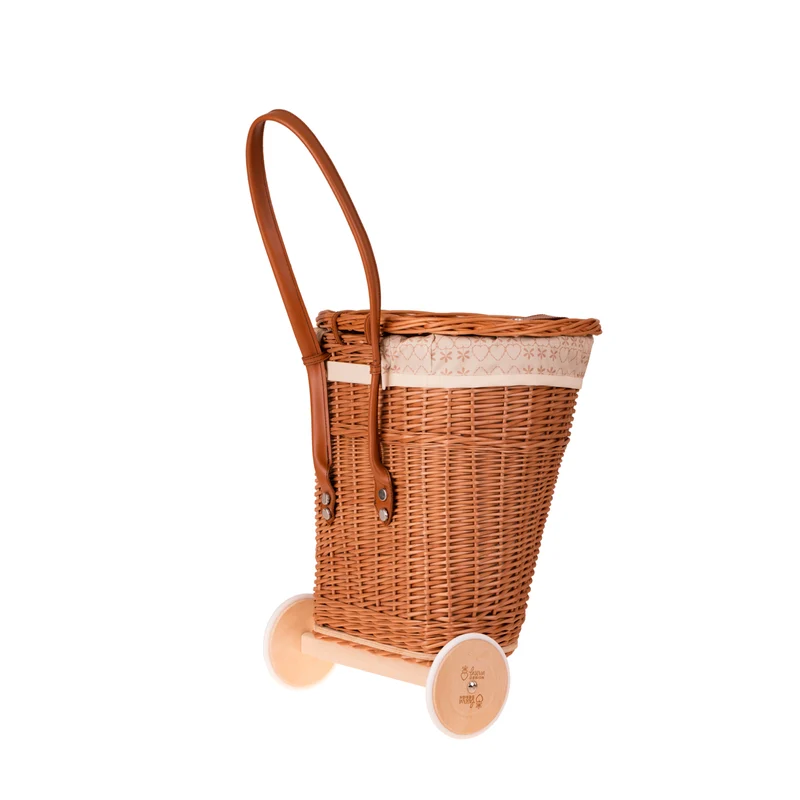 Celtis wicker basket on wheels with cream trim and straps TheWickerStories