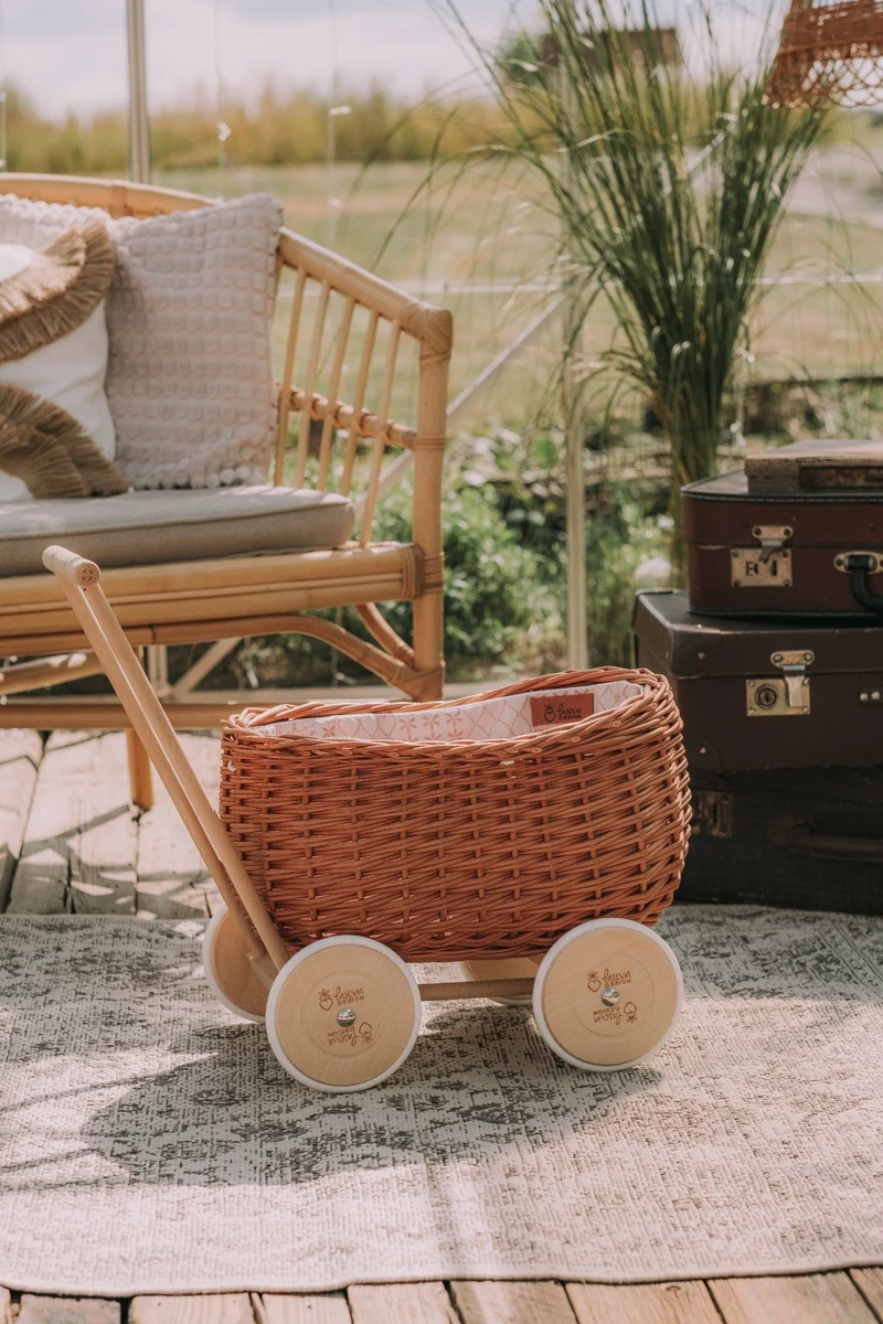 Luke wicker push walker with cream trim, handle and wheels TheWickerStories