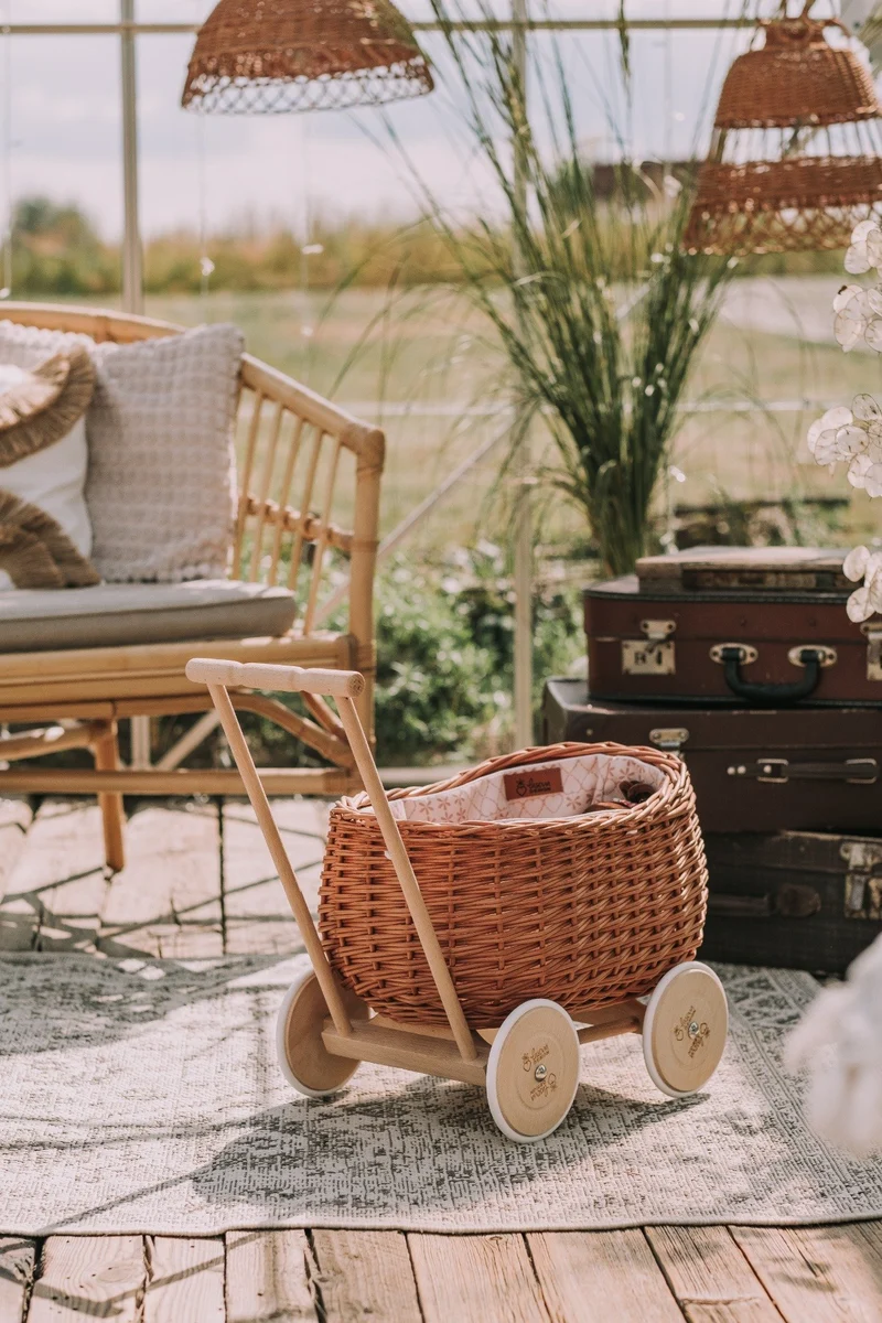 Luke wicker push walker with cream trim, handle and wheels TheWickerStories