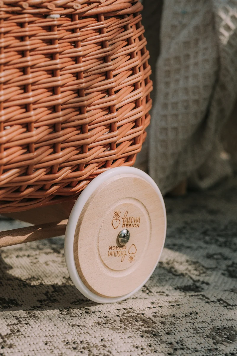 Luke wicker push walker with cream trim, handle and wheels TheWickerStories