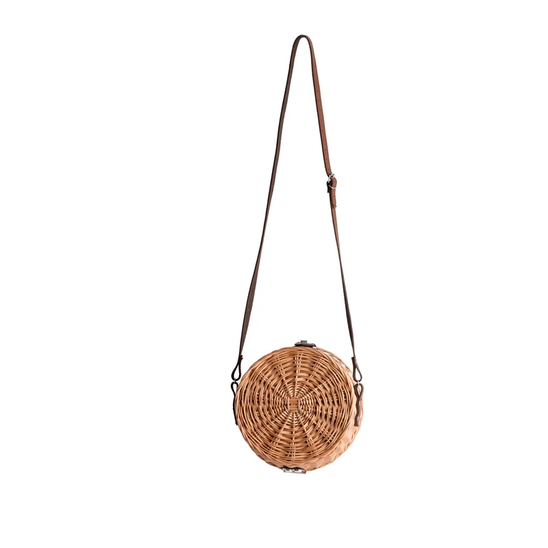 Rivora wicker shoulder bag with trim, flap, leather strap, and metal clasp TheWickerStories