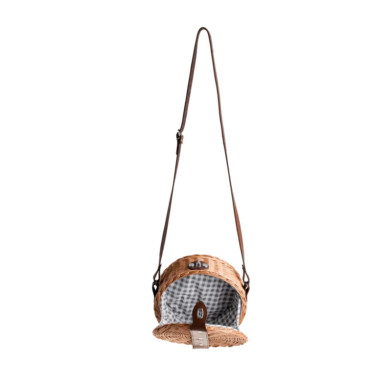 Rivora wicker shoulder bag with trim, flap, leather strap, and metal clasp TheWickerStories