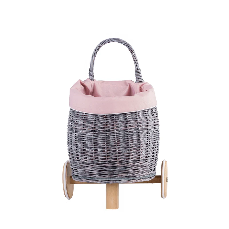 Luke wicker push-along doll pram with pink trim, handle and wooden wheels TheWickerStories
