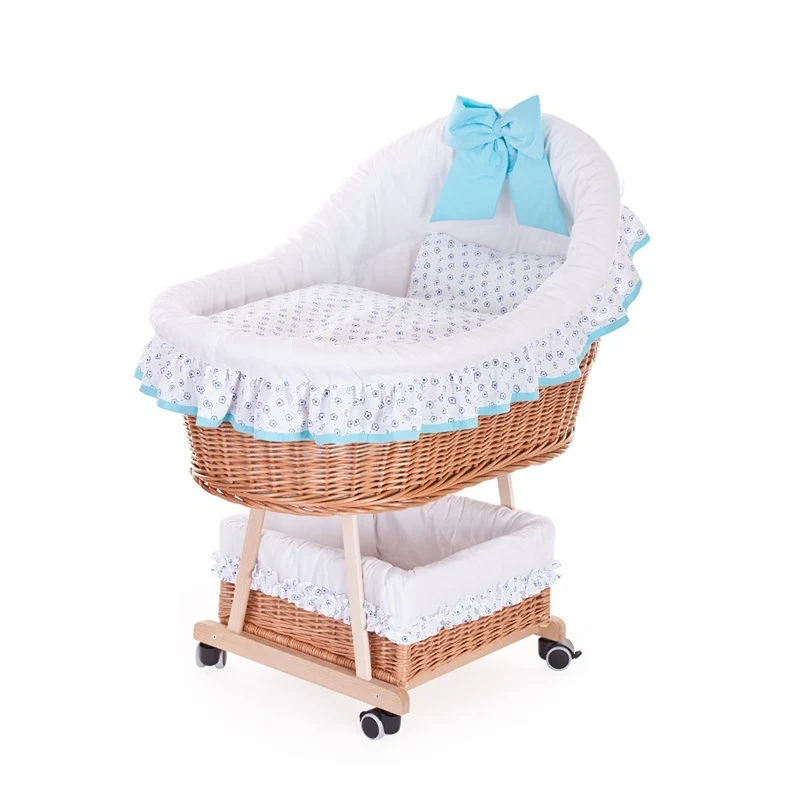 Papilio wicker bassinet for infants with white trim and light blue accents, with canopy, blanket and pillow, on wheels with brake TheWickerStories