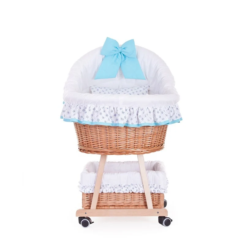 Papilio wicker bassinet for infants with white trim and light blue accents, with canopy, blanket and pillow, on wheels with brake TheWickerStories