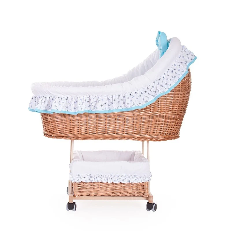 Papilio wicker bassinet for infants with white trim and light blue accents, with canopy, blanket and pillow, on wheels with brake TheWickerStories