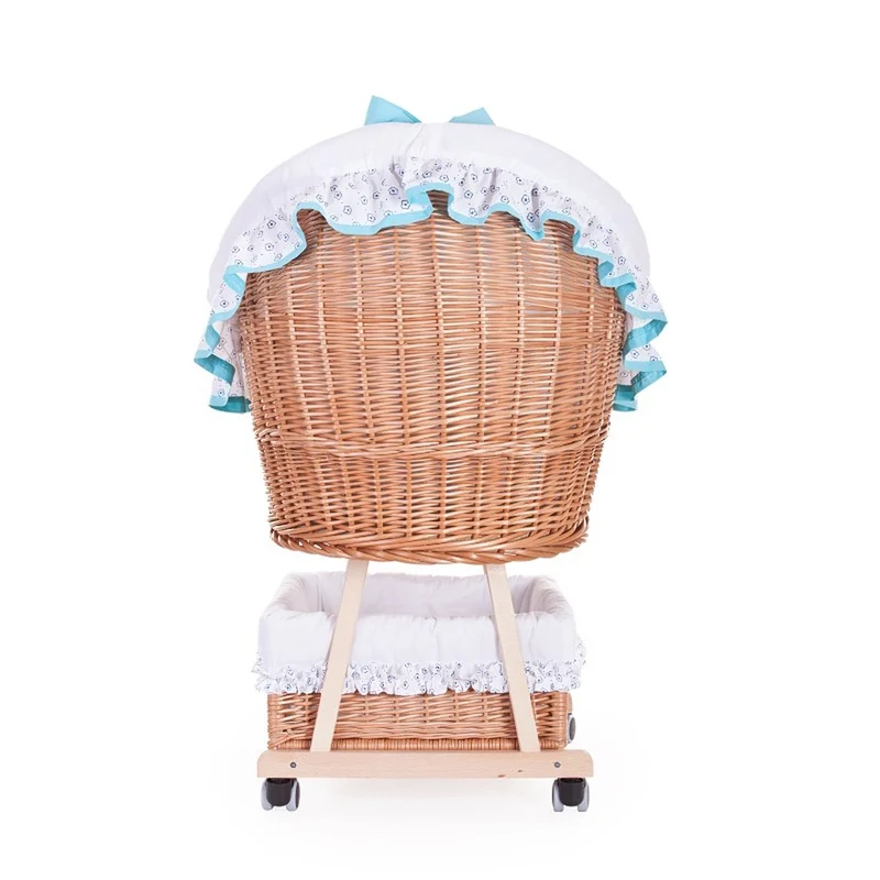 Papilio wicker bassinet for infants with white trim and light blue accents, with canopy, blanket and pillow, on wheels with brake TheWickerStories