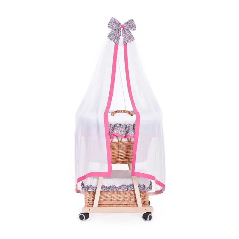 Papilio wicker baby cradle with pink trim, canopy, pillow and quilt TheWickerStories