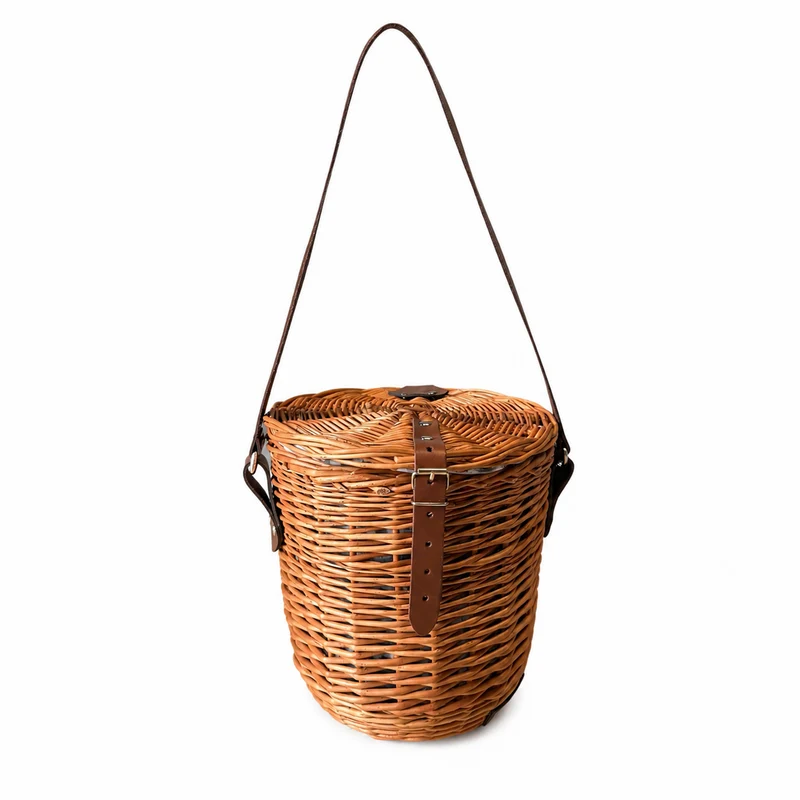 Rivora wicker shoulder basket with fabric lining, lid, and leather strap TheWickerStories