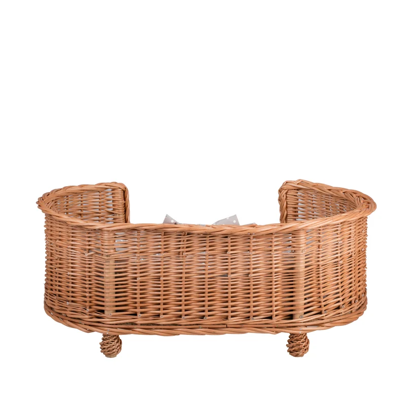 Esoria wicker pet bed for dogs and cats with a beige cushion, elevated on legs with a low entry TheWickerStories