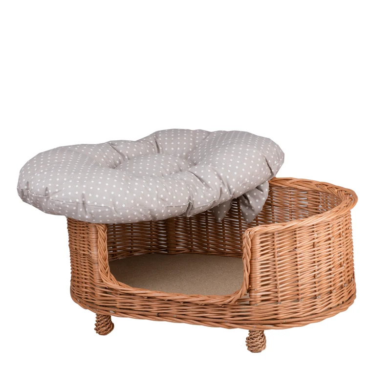 Esoria wicker pet bed for dogs and cats with a beige cushion, elevated on legs with a low entry TheWickerStories
