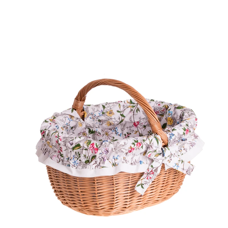 Werburga shopping basket with a wicker handle and white trim TheWickerStories