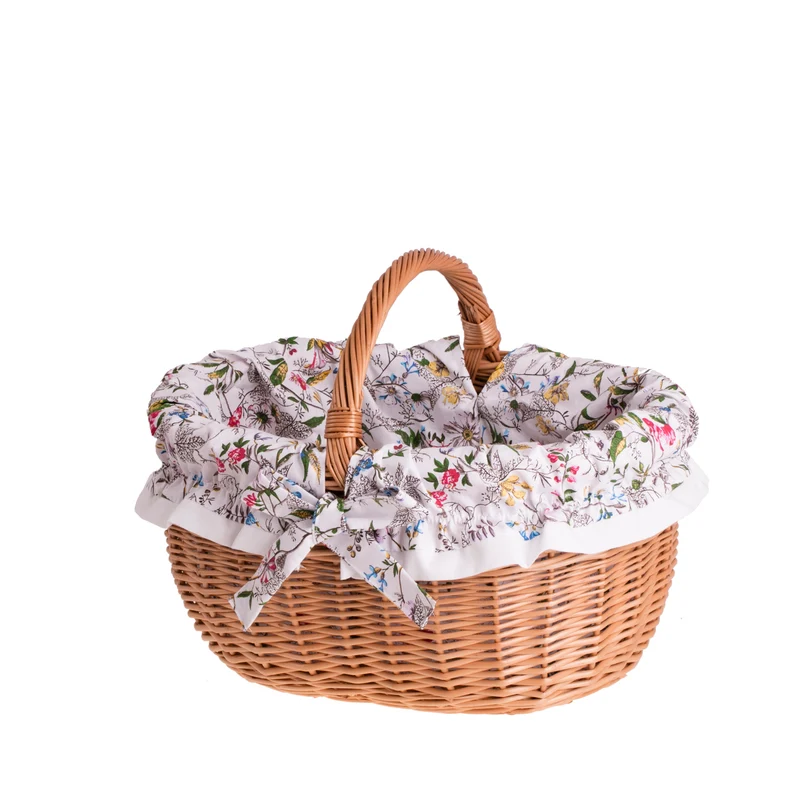Werburga shopping basket with a wicker handle and white trim TheWickerStories