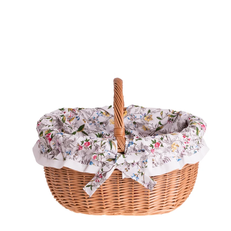 Werburga shopping basket with a wicker handle and white trim TheWickerStories