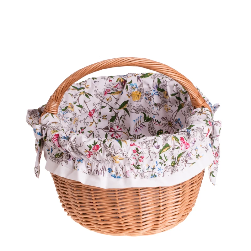 Werburga shopping basket with a wicker handle and white trim TheWickerStories