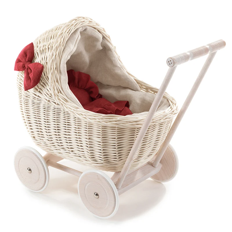 Desayer wicker doll stroller with linen trim and red bedding, featuring a handle, quilt, and pillow TheWickerStories