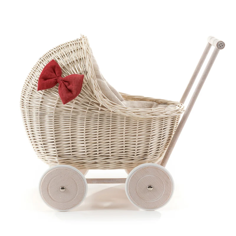 Desayer wicker doll stroller with linen trim and red bedding, featuring a handle, quilt, and pillow TheWickerStories
