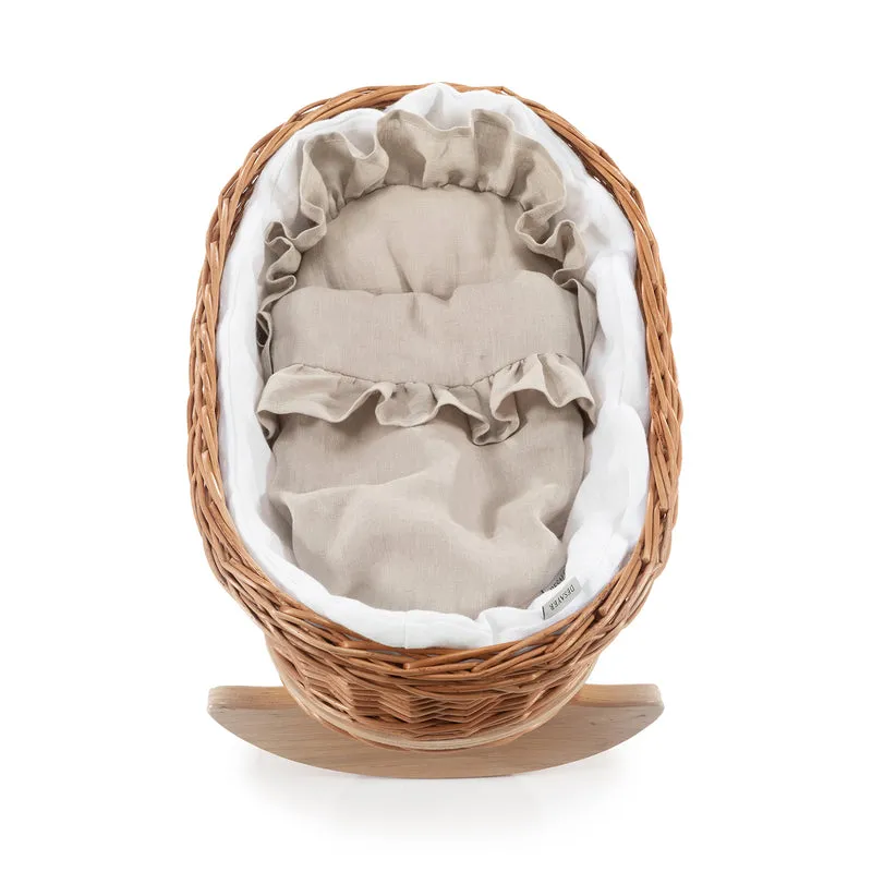 Desayerwiklinowa wicker doll cradle with white trim, pillow and quilt on beech rockers TheWickerStories