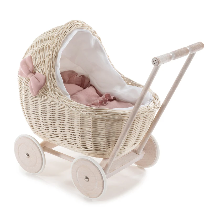 Desayer wicker doll stroller with linen trim and pink bedding, including a quilt, pillow, and handle TheWickerStories