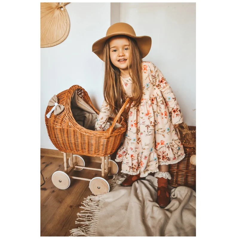 Lena wicker doll stroller with beige trim, blanket, and pillow TheWickerStories