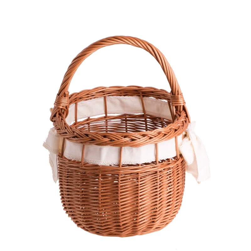 Winalia wicker shopping basket with cream trim, handle, and bow TheWickerStories