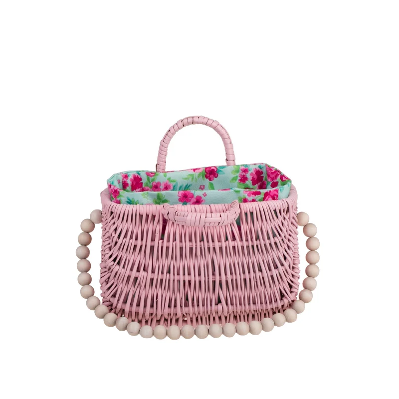 Werlissa wicker basket-handbag for women with mint trim, handle, and decorative beads TheWickerStories