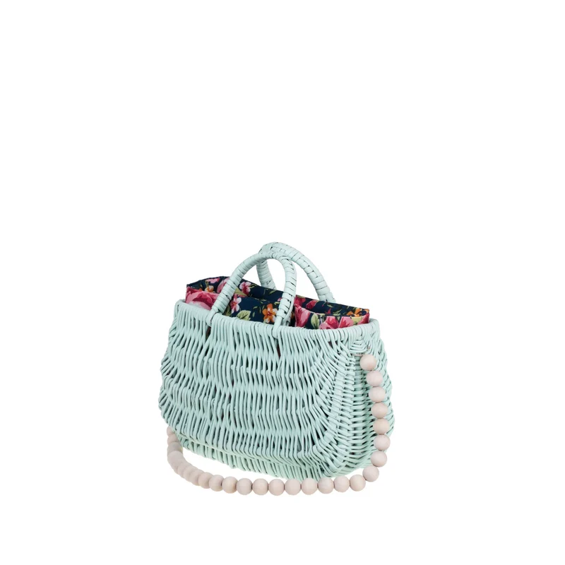 Werlissa wicker beach bag with navy trim, featuring handles and a strap made of wooden beads TheWickerStories