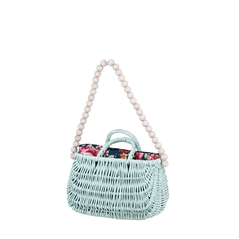 Werlissa wicker beach bag with navy trim, featuring handles and a strap made of wooden beads TheWickerStories