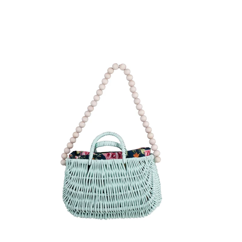 Werlissa wicker beach bag with navy trim, featuring handles and a strap made of wooden beads TheWickerStories