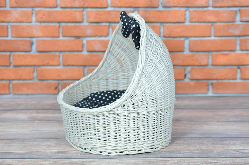 Elsa wicker pet bed basket with black cushion and bow TheWickerStories