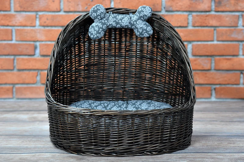 Elsa wicker basket pet bed with gray cushion and bone TheWickerStories